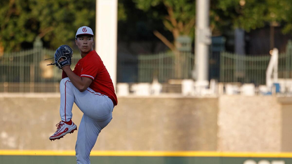 Grapevine pitcher Benjamin Chen (18) winds up for a pitch during a UIL 5A D2 semifinal baseball game at Riders Park in Frisco, Texas, Friday, May 30, 2025.