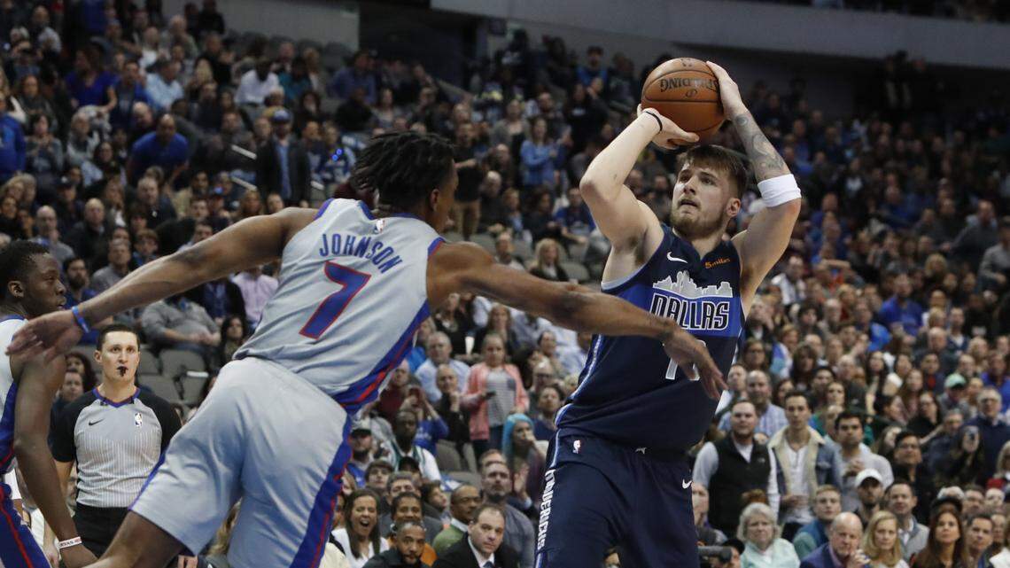 Dallas Mavericks forward Luka Doncic (77) shoots against Detroit Pistons forward Stanley Johnson (7) during the second half of an NBA basketball game in Dallas, Friday, Jan. 25, 2019. (AP Photo/LM Otero)