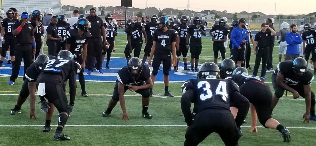 North Crowley quarterback Caleb Leake (4) and the rest of the Panthers get ready for their District 4-6A opener against Arlington Bowie at Panther Stadium. Sept. 28, 2018. Darren Lauber