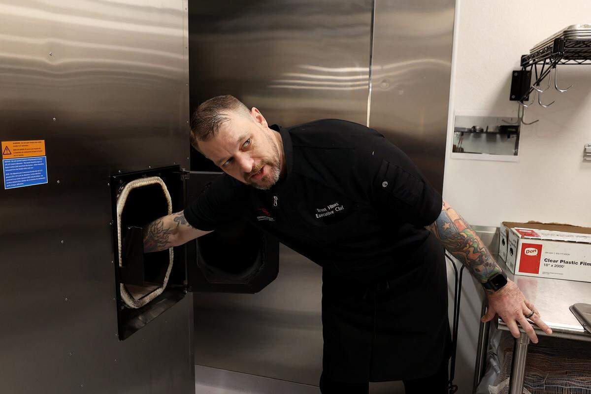 Executive Chef Brent Hines shows off the smoker in the new Fort Worth Convention Center kitchens on Monday, Dec. 8, 2025.