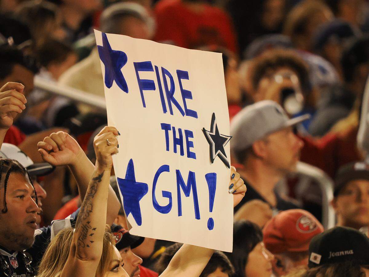 Oct 27, 2024; Santa Clara, California, USA; A Dallas Cowboys fan holds a sign reading “fire the GM” during the second quarter against the San Francisco 49ers at Levi’s Stadium. Mandatory Credit: Kelley L Cox-Imagn Images