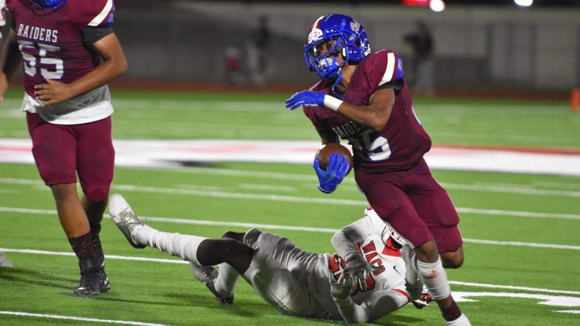 Martavious Boswell (25) runs the ball for the Fort Worth Southwest Raiders after his second touchdown of the night against Waco during a high school football game at Clark Stadium on Friday.