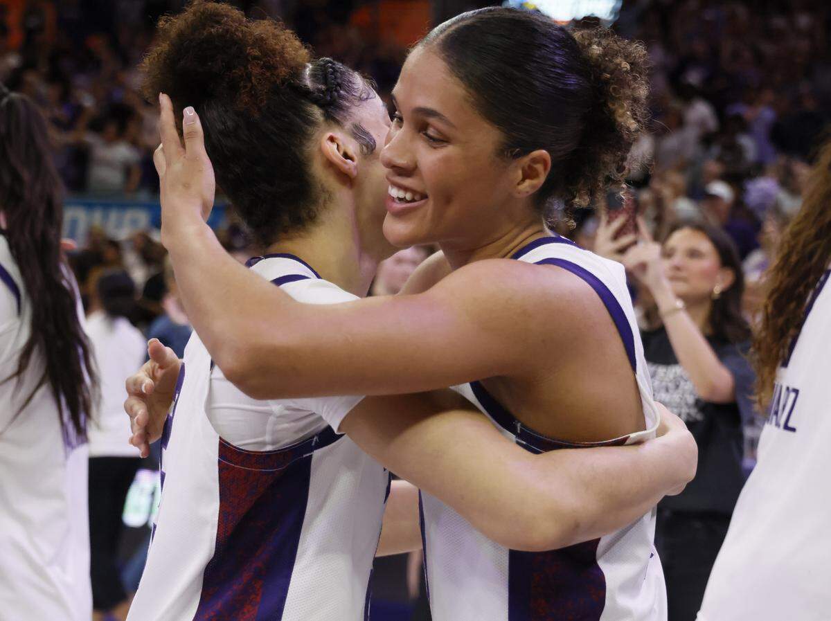TCU guards Veronica Sheffey (2) and Donovyn Hunter (4) embrace after besting Washington in the fifth quarter of a second round NCAA Division I Women's Basketball Championship game at Schollmeier Arena in Fort Worth, Texas, Sunday, March, 22, 2026.
