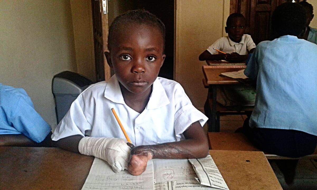 Maggie attends school through Arise Africa in Zambia.