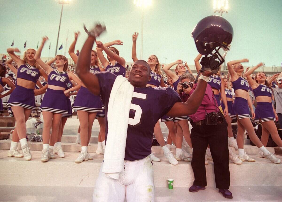 Nov. 20, 1999: TCU tailback LaDainian Tomlinson celebrates breaking the NCAA record for most yards rushing in a single game during the school song after their win over UTEP at Amon G. Carter Stadium.