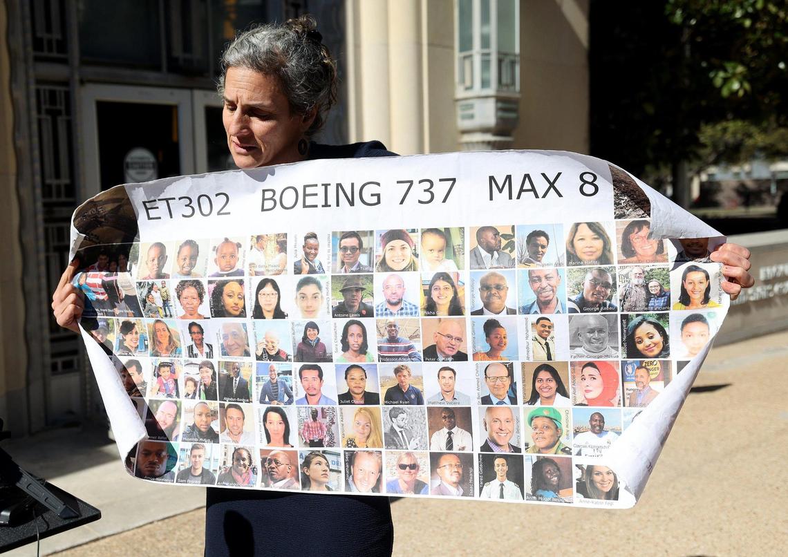 Nadia Millerson, the mother of Samya Stumo who was killed in one of the two plane crashes involving a Boeing 737 MAX, unfurls a banner with photographs of some of the victims following an arraignment at the federal courthouse in Fort Worth on Thursday, January 26, 2023, at the federal court in Fort Worth. She and other family members attended an arraignment challenging the plea agreement Boeing made with the Justice Department that granted them immunity from criminal prosecution.