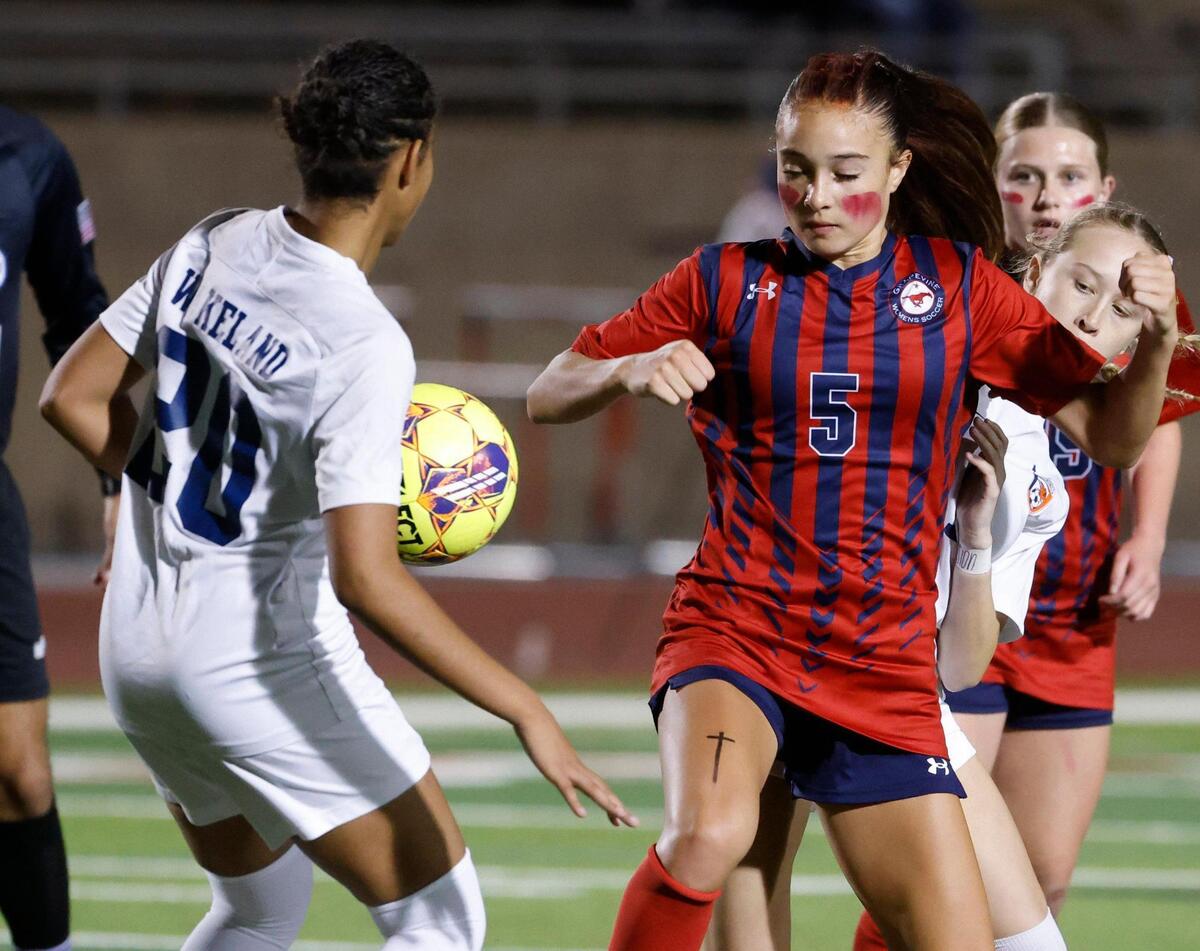 Frisco Wakeland forward Morgan Landry (20) stops the pass in front of Grapevine midfielder Tatum Harig (5) during the Class 5A D2 UIL state semifinal girls soccer playoff game at Buddy Echols Field in Coppell, Texas, Friday, Apr. 05, 2025.