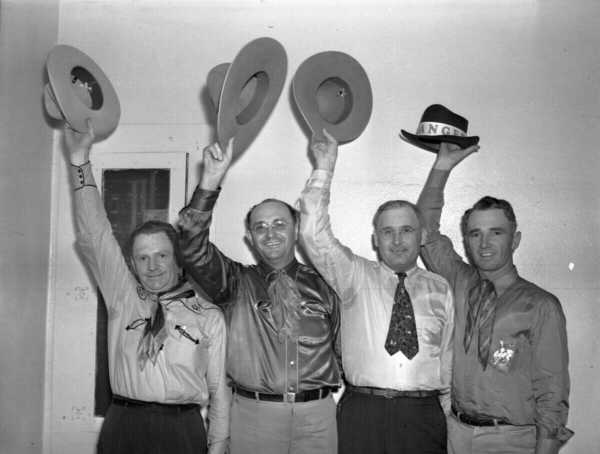 Aug. 26, 1940: Ranger Rodeo and Labor Day Celebration. Publicity men. Left to right, Bill Mayes, Mayor Hall Walker, Joe Dennis and Sig Faircloth, seen standing up waving a hat in the air.