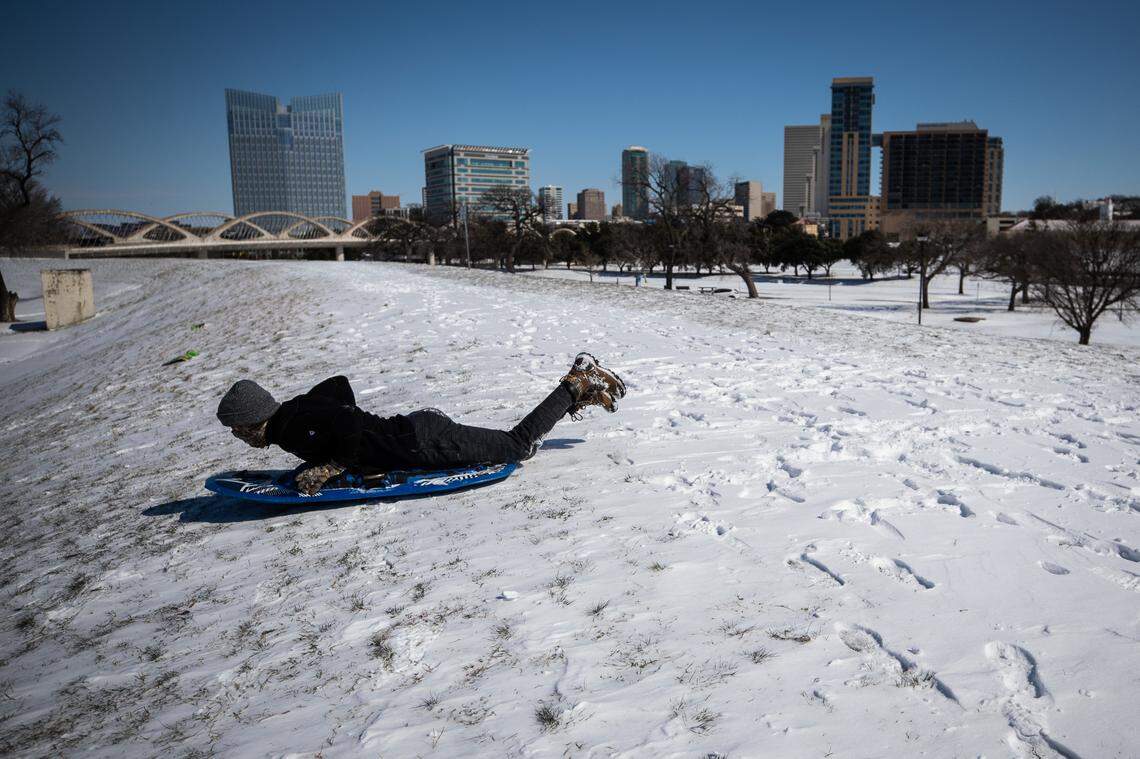 Caleb Smith sleds down the hill on Feb. 15, 2021, at Trinity Park in Fort Worth.