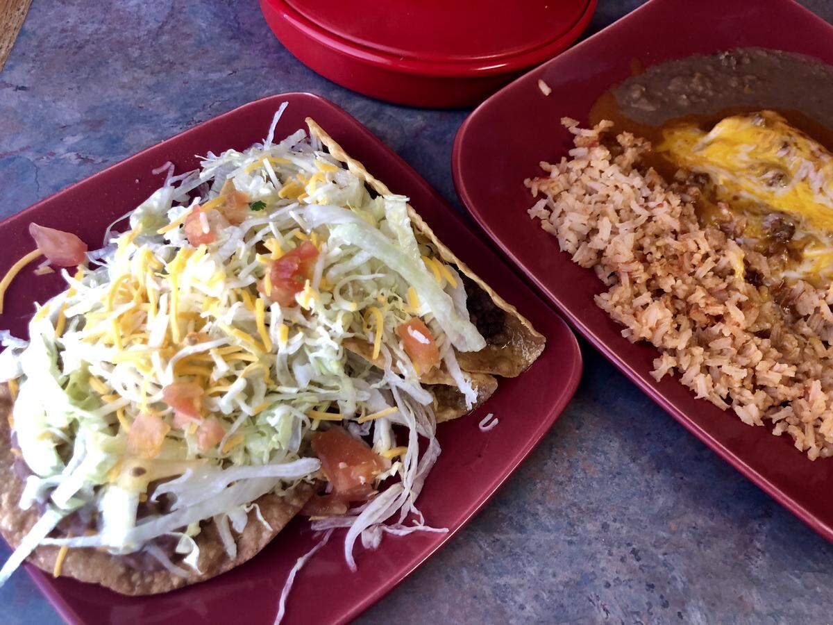 Rivas Cafe, reopened in north Fort Worth. serves its classic combination platter with two enchiladas, two tacos and a chalupa.