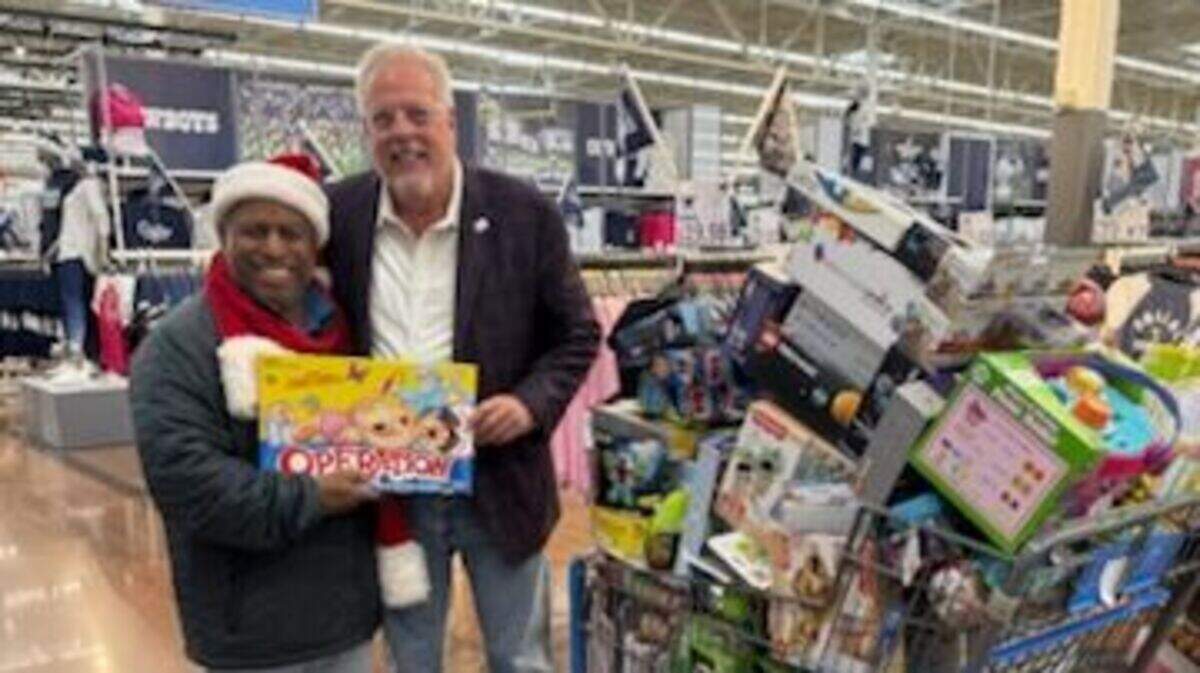 Watson Robinson Jr. joined Arlington Mayor Jim Ross on Friday, Dec. 13, 2024, at the Walmart on Randol Mill Road as the store donated $25,000 in toys for for Toys for Tots.