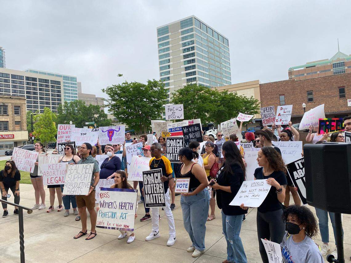 Dozens of abortion rights supporters gathered outside the Tarrant County Courthouse Saturday morning protesting against a leaked draft decision from the Supreme Court to overturn Roe v. Wade.