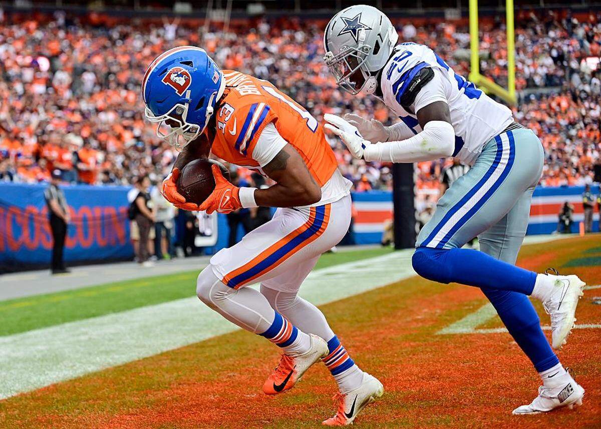 DENVER, COLORADO - OCTOBER 26: Pat Bryant #13 of the Denver Broncos catches a touchdown against Trikweze Bridges #25 of the Dallas Cowboys during the second quarter in the game at Empower Field At Mile High on October 26, 2025 in Denver, Colorado. (Photo by Dustin Bradford/Getty Images)