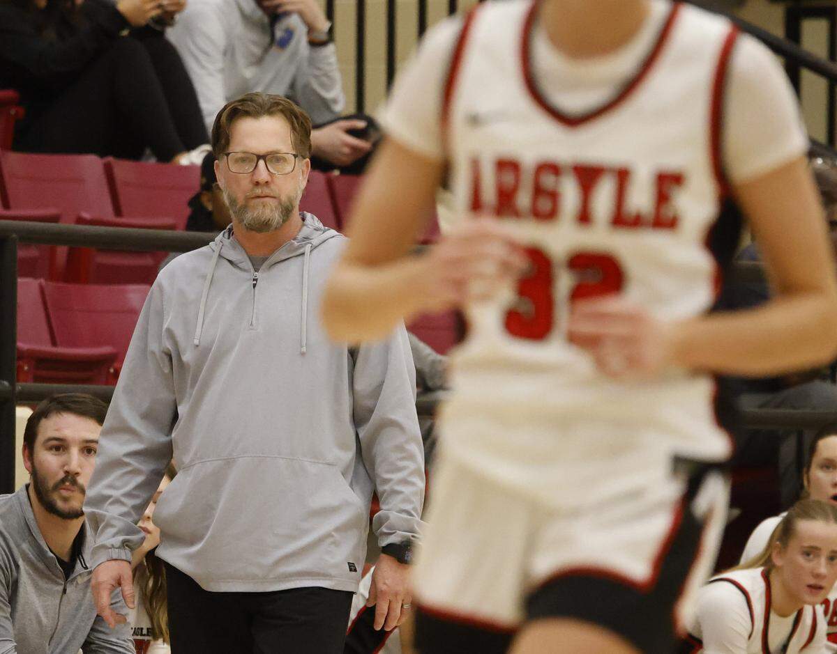 Argyle head coach Chance Westmoreland watches action against Mansfield Summit during the first half of a UIL Class 5A DII girls playoff basketball game at Saginaw High School in Saginaw, Texas, Thursday Feb. 19, 2026.