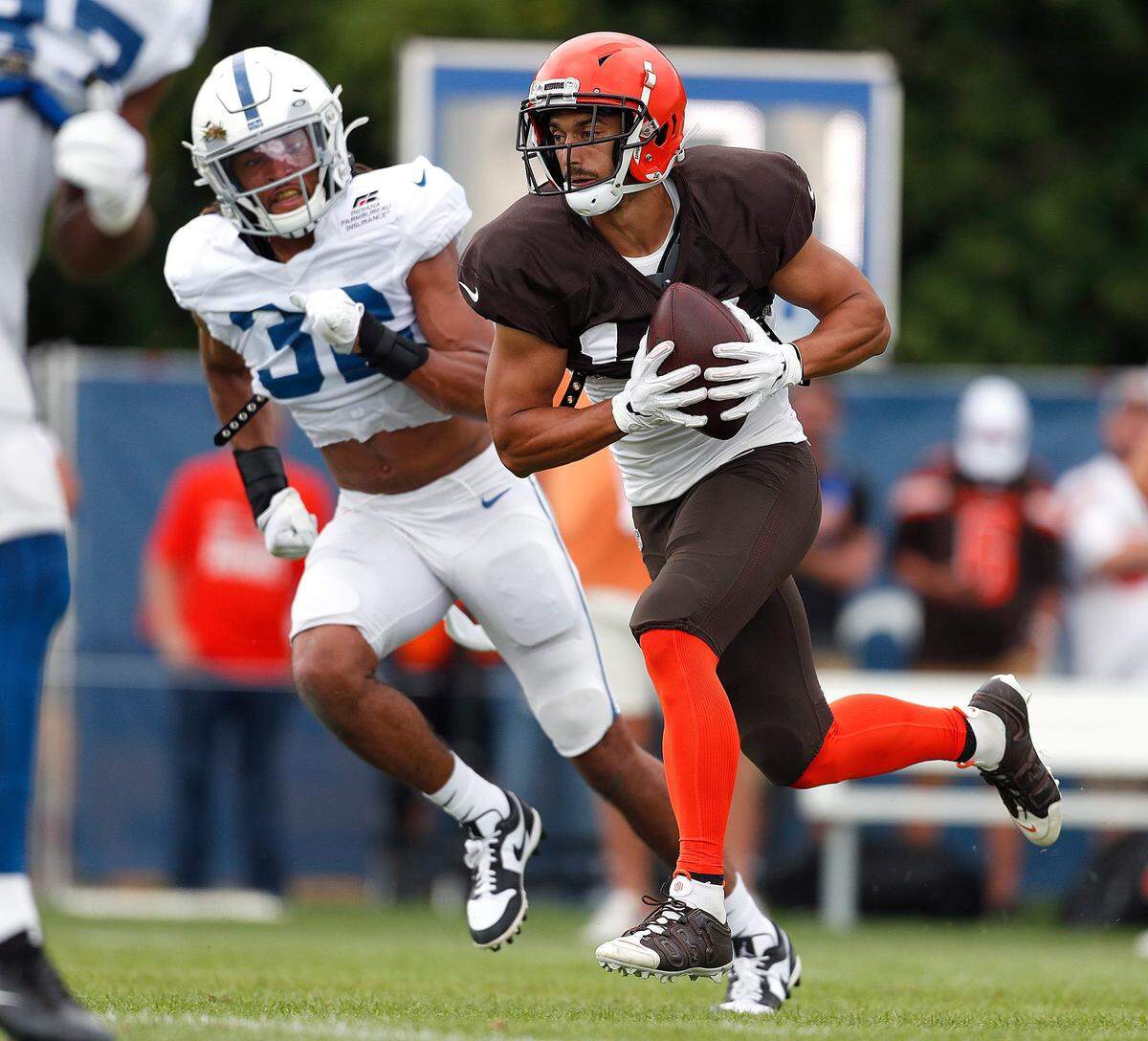 Cleveland Browns wide receiver Damon Sheehy-Guiseppi (15) runs by Indianapolis Colts cornerback Jalen Collins (32) during their preseason training camp practice at Grand Park in Westfield on Wednesday, August 14, 2019.Colts Preseason Training Camp