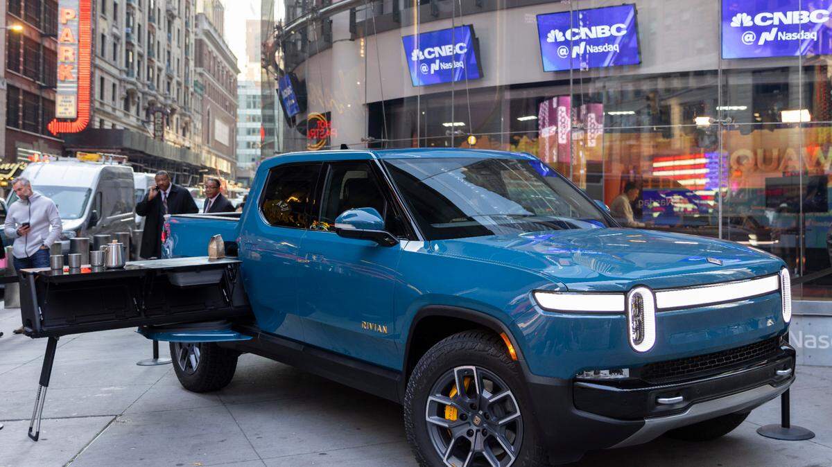 Rivian’s all-electric truck was on display on listing day in Times Square in November. The automaker announed Thusday it is building a $5 billion battery and assembly plant east of Atlanta.