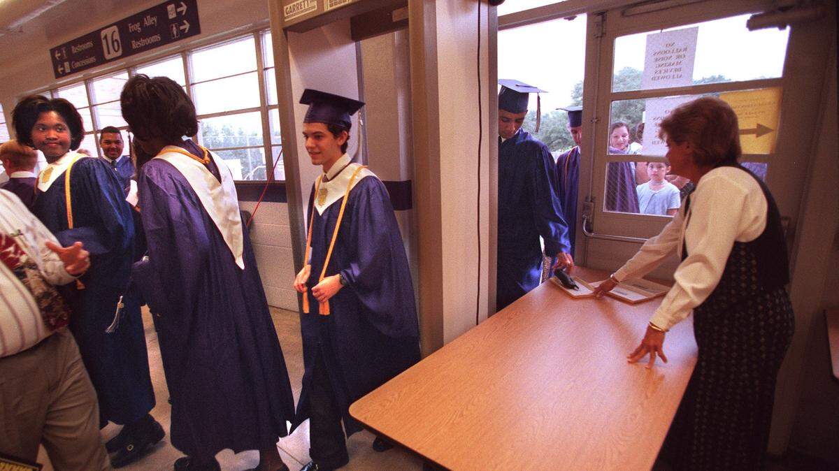 Graduates go thru security before Paschal High School's graduation at Texas Christian University in 1999.