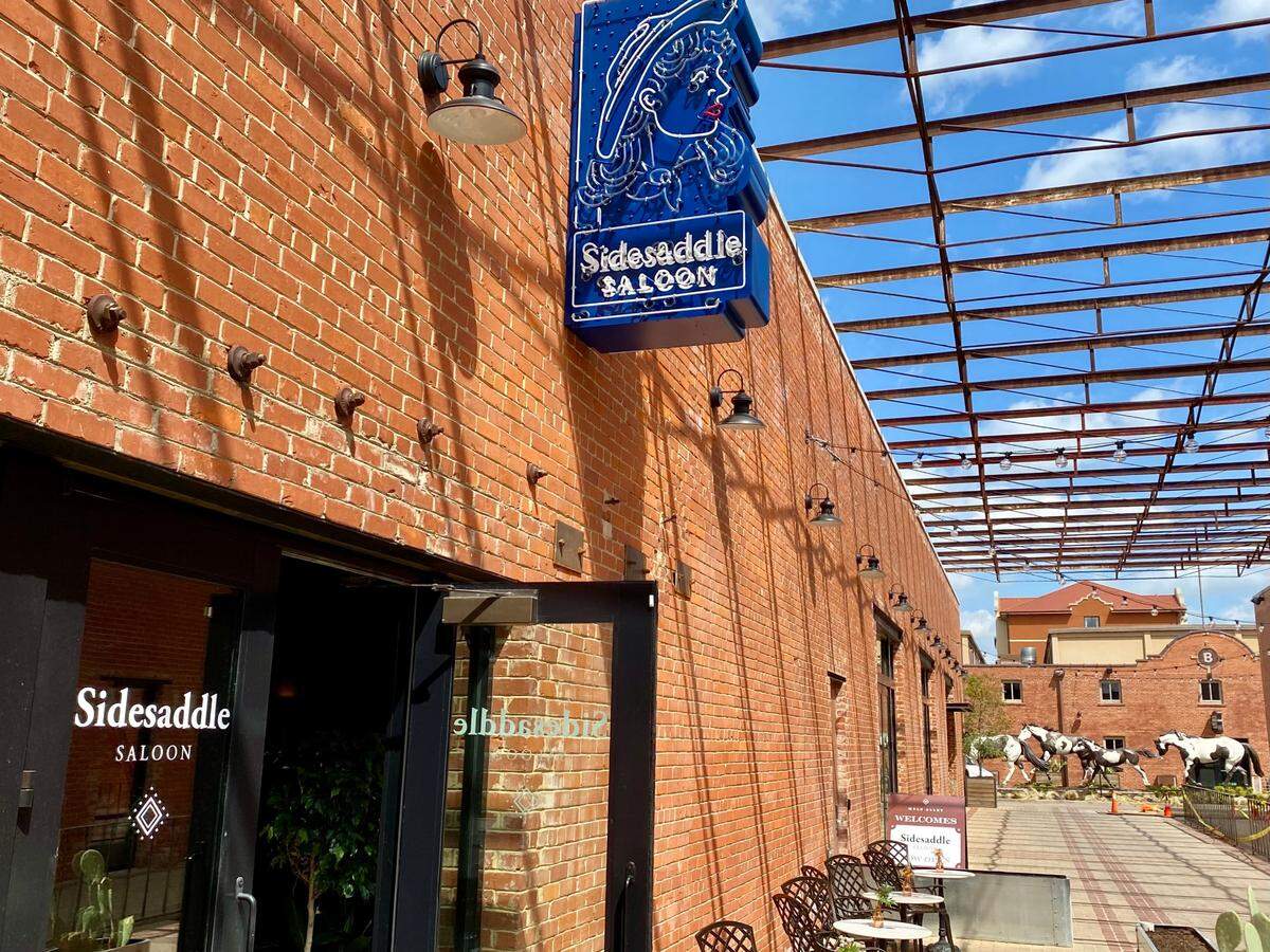Siidesaddle Saloon in Mule Alley is down a sidewalk toward Saunders Park.