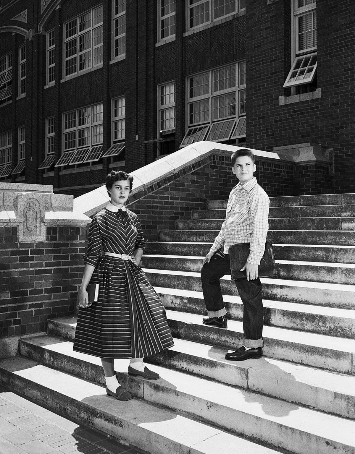 July 31, 1953: “Nancy and John Unger are dressed for class at Paschal High and McLean Junior High, respectively. Her AnR Junior cotton dress, which enters into the all-year-round fashion scheme, uses a new touch of leather in its yellow kid belt and collar. John tops his brand new jeans with a soft and warm plaid flannel shirt by Little Champ of Hollywood.”