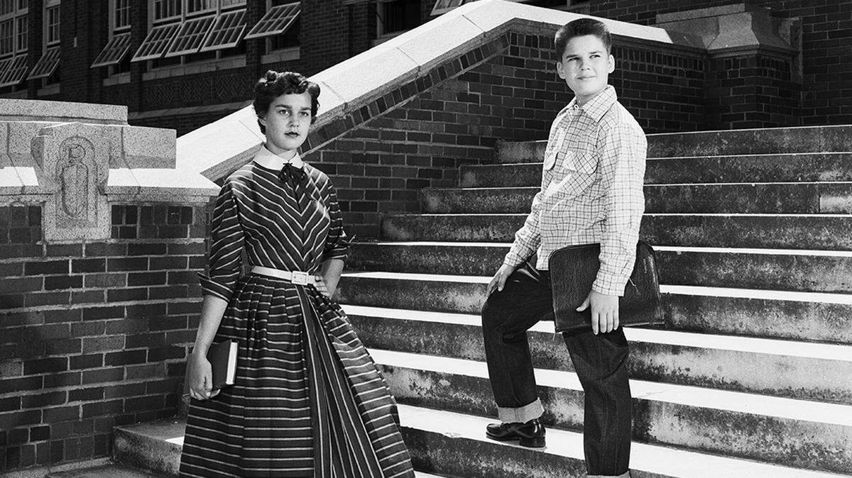 July 31, 1953: “Nancy and John Unger are dressed for class at Paschal High and McLean Junior High, respectively. Her AnR Junior cotton dress, which enters into the all-year-round fashion scheme, uses a new touch of leather in its yellow kid belt and collar. John tops his brand new jeans with a soft and warm plaid flannel shirt by Little Champ of Hollywood.”
