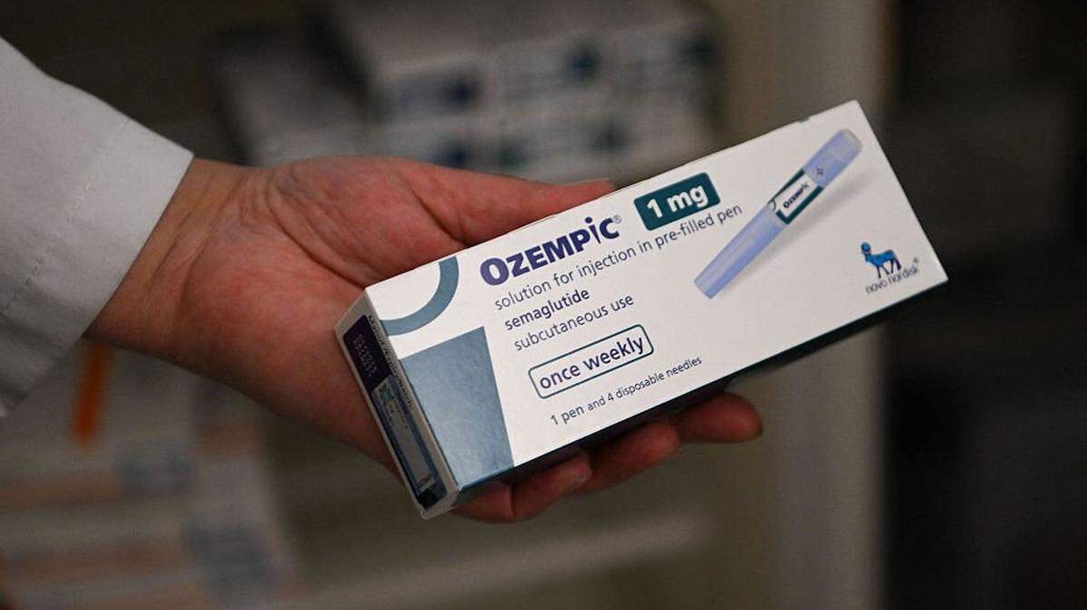 A pharmacy owner shows an Ozempic antidiabetic medicine at a pharmacy in Pristina on March 27, 2025. The antidiabetic medicine of Ozempic is surging in Kosovo as a quick-fix weight loss solution, driving up demand and sending prices soaring, despite warnings about possible side effects of the Diabetes drug. (Photo by Armend NIMANI / AFP) (Photo by ARMEND NIMANI/AFP via Getty Images)