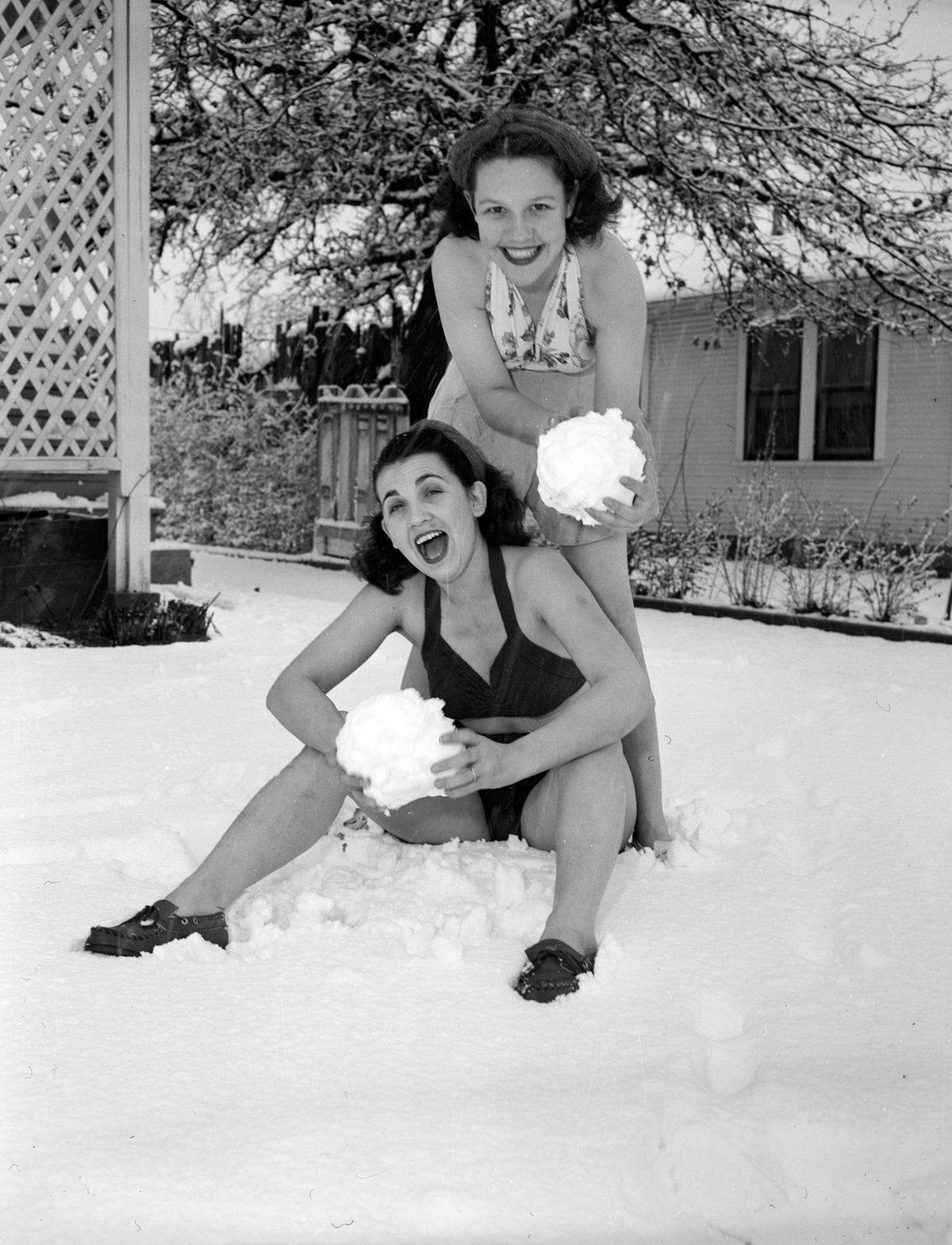 March 7, 1947: “Anna Bell Eggen and Sue Massey playing in the snow while wearing bathing suits.”