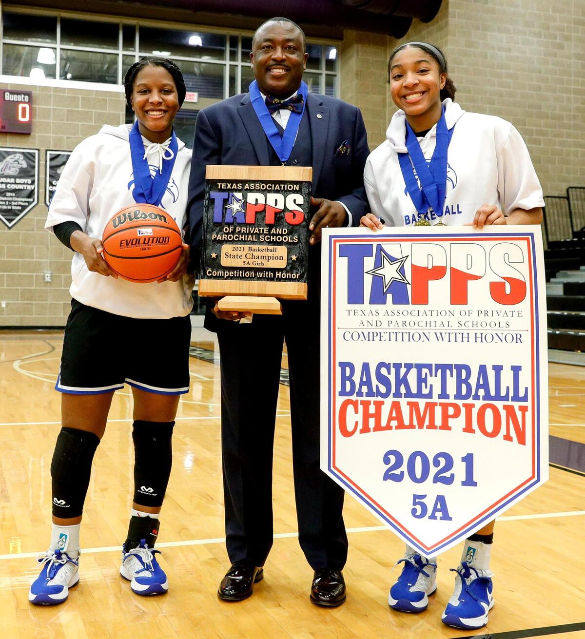 Fort Worth Southwest Christian guard Arieona Rosborough (L), head coach Larry Menendez Jr and guard Ariele Rosborough (R) win the 5A TAPPS Girls Basketball State Championship against Houston Second Baptist, 54-40 played March 12, 2021 at College Station High School in College Station, TX. (Steve Nurenberg Special to the Star-Telegram)