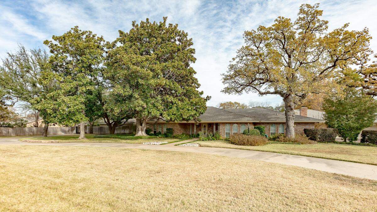 The home at 4605 Kelly Elliott Road offers the rustic privacy of 2.88 acres with easy highway access.