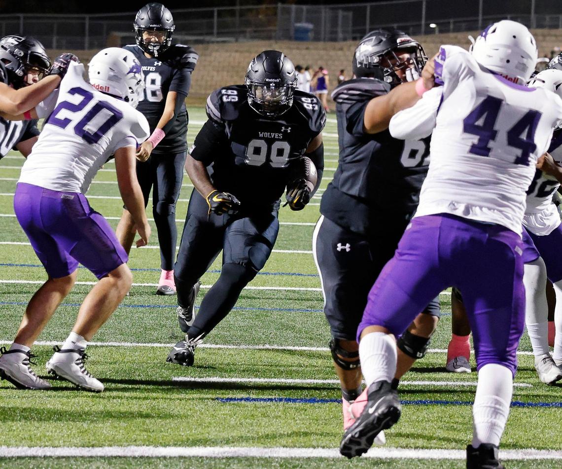 Timberview defensive lineman Dilan Battle (99) takes it four yards for the six in the second half of a UIL football game at Vernon Newsom Stadium in Mansfield, Texas, Thursday, Oct. 19, 2023.