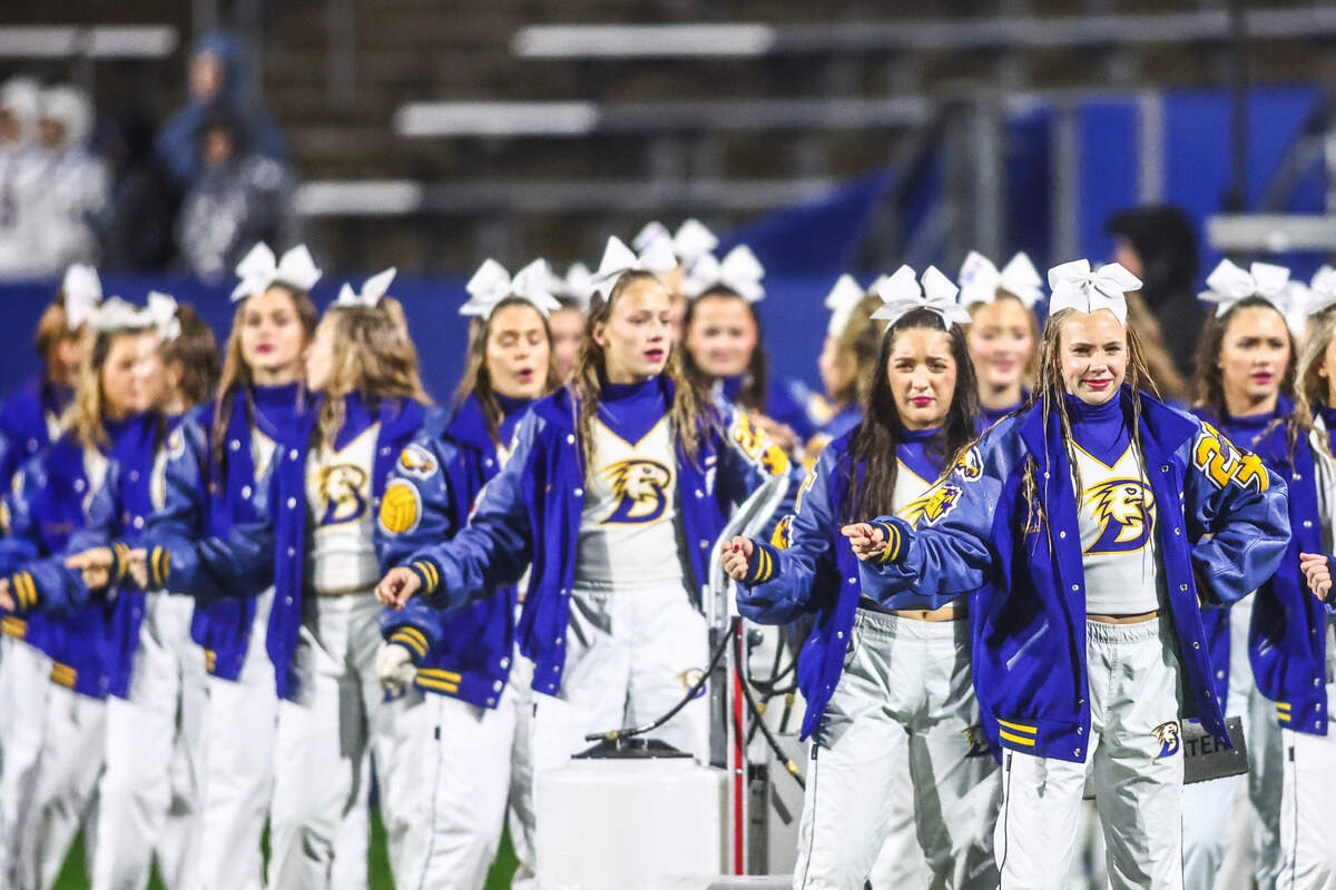 Brock cheerleaders perform on the sideline in the 4A Division II state semifinal Friday, Dec. 13, playoff game at McKinney ISD Stadium.