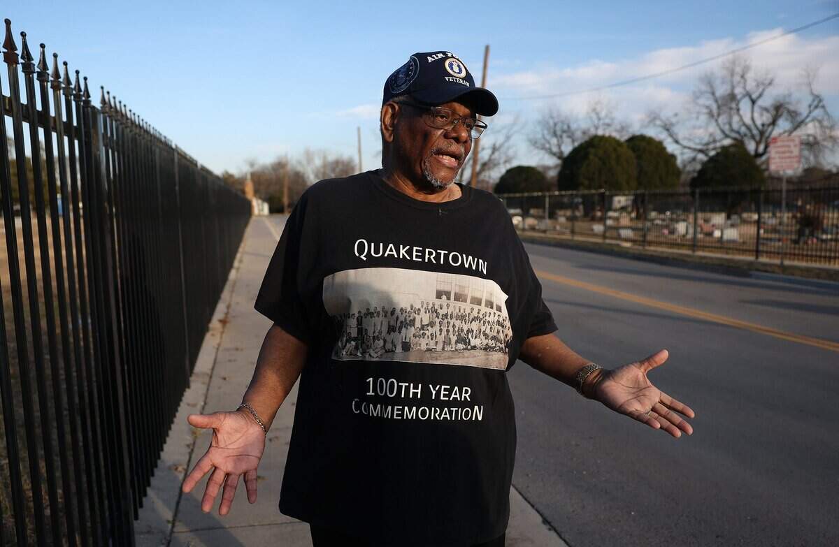 Rev. Reginald Logan stands on East Prairie Street next to Oakwood Cemetery in southeast Denton on Thursday, Feb. 12, 2026. Logan, who grew up next to the cemetery, remembers it as a place he and other children of the neighborhood used as green space to play.