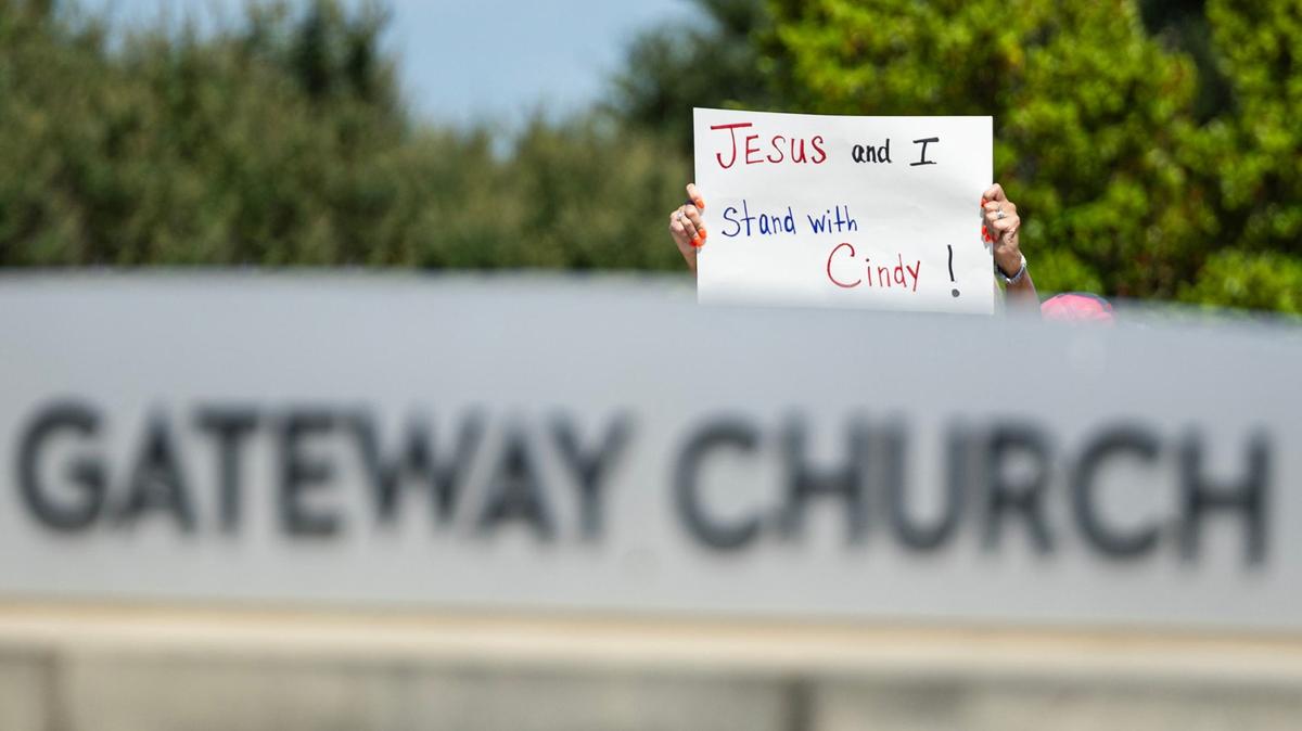 People gather in protest of child and sexual abuse in the church outside of Gateway Church in Southlake on June 22, 2024.