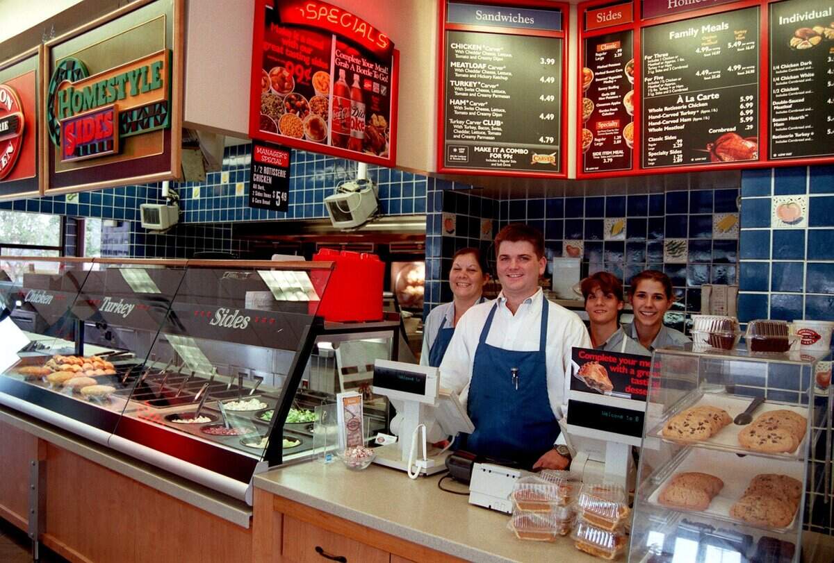May 28, 1999: Boston Market employees Bonnie Benz, left, general manager Kenneth Robertson, LeAnn Warnock and Brandi Good behind the Southlake store's counter.
