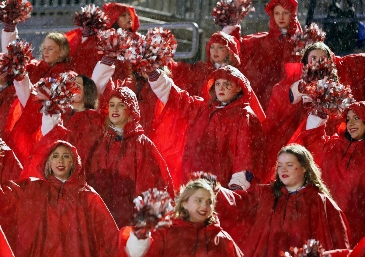 The Grapevine Fabulous Fillies were prepared for the rain in the first half of a UIL 5A D2 football playoff game at Mustang Panther Stadium in Grapevine, Texas, Thursday, Nov. 09, 2023. The Emerson Maverics led the Grapevine Mustangs 14-3 at the half. (Special to the Star-Telegram Bob Booth)