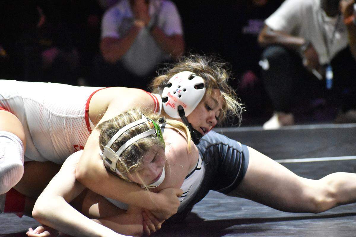 Arlington Martin wrestler Camille Rainey fights for positioning at the UIL Texas high school wrestling state tournament in Cypress, Texas, on Saturday, Feb. 14, 2026.