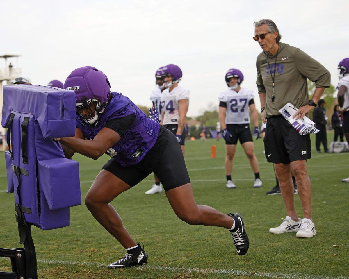 TCU linebacker Max Carroll hits the sled during the first day of spring football practice at TCU in Fort Worth, Texas, Tuesday, March 24, 2026.