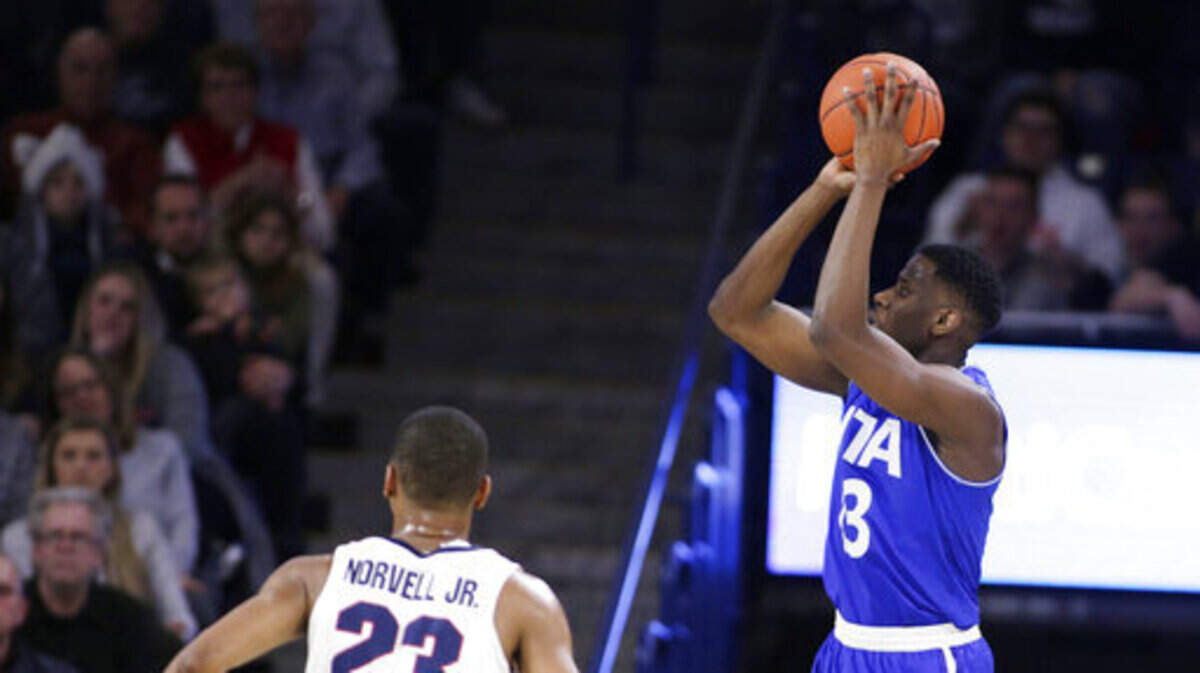 Texas-Arlington forward Jabari Narcis, right, shoots near Gonzaga guard Zach Norvell Jr. (23) during the first half of an NCAA college basketball game in Spokane, Wash., Tuesday, Dec. 18, 2018. (AP Photo/Young Kwak)