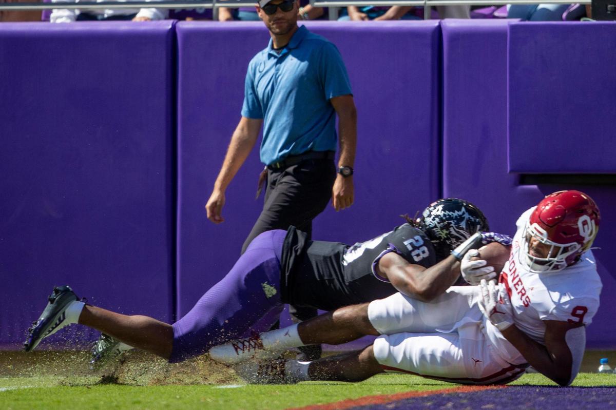 OU tight end Brayden Willis scores a touchdown despite TCU safety Millard Bradford’s tackle at the Amon G. Carter Stadium in Fort Worth, Texas, on Saturday, Oct. 1, 2022.