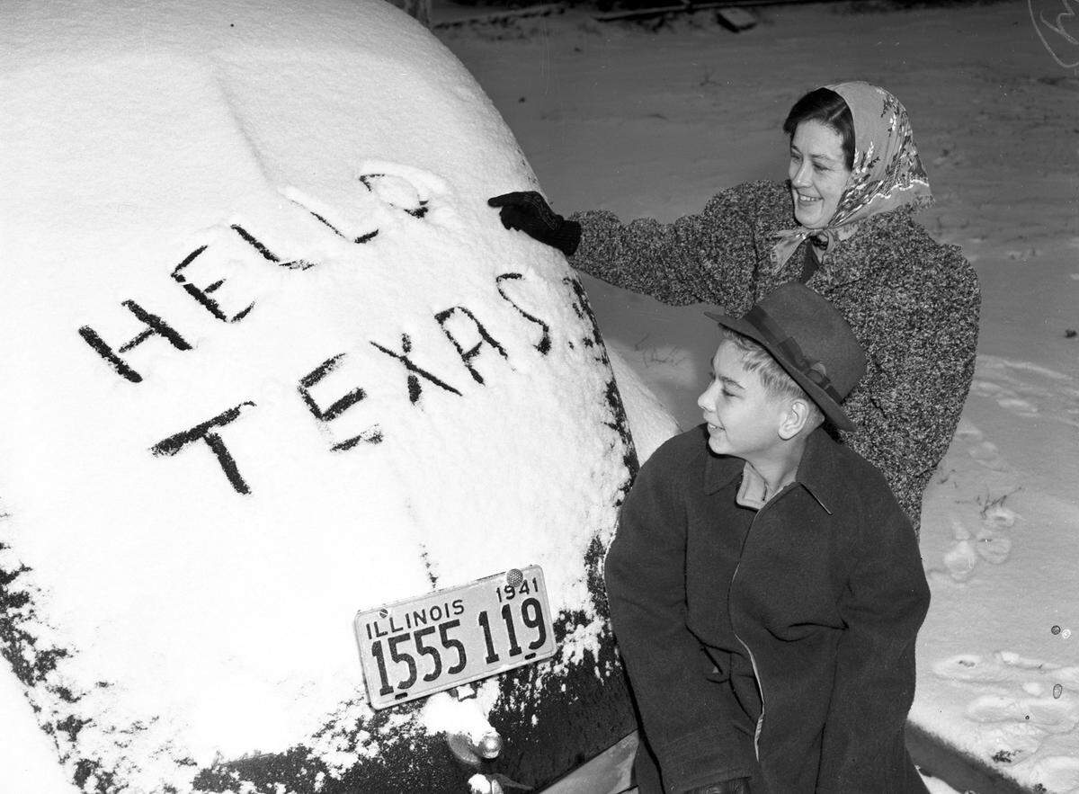 Jan. 2, 1942: “The blanket of white that covered almost everything Saturday morning was like a message from home for the Henry Whitts at 1535 Pulaski St. They came here two weeks ago from Champaign, Illinois. Whitt, a sheet metal worker, is employed at the Lake Worth bomber assembly plant. Mrs. Whitt and Henry Junior, 14, are shown by their car. Mrs. Whitt and young Henry are smiling and looking at their car which is covered in snow.”