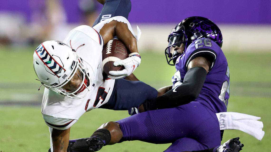 TCU free safety Bud Clark tackles Duquesne wide receiver Wykeen Gill during Saturday’s season opener at Amon G. Carter Stadium. The Horned Frogs won 45-3 on a day when many defenses across the country dominated opposing offenses.