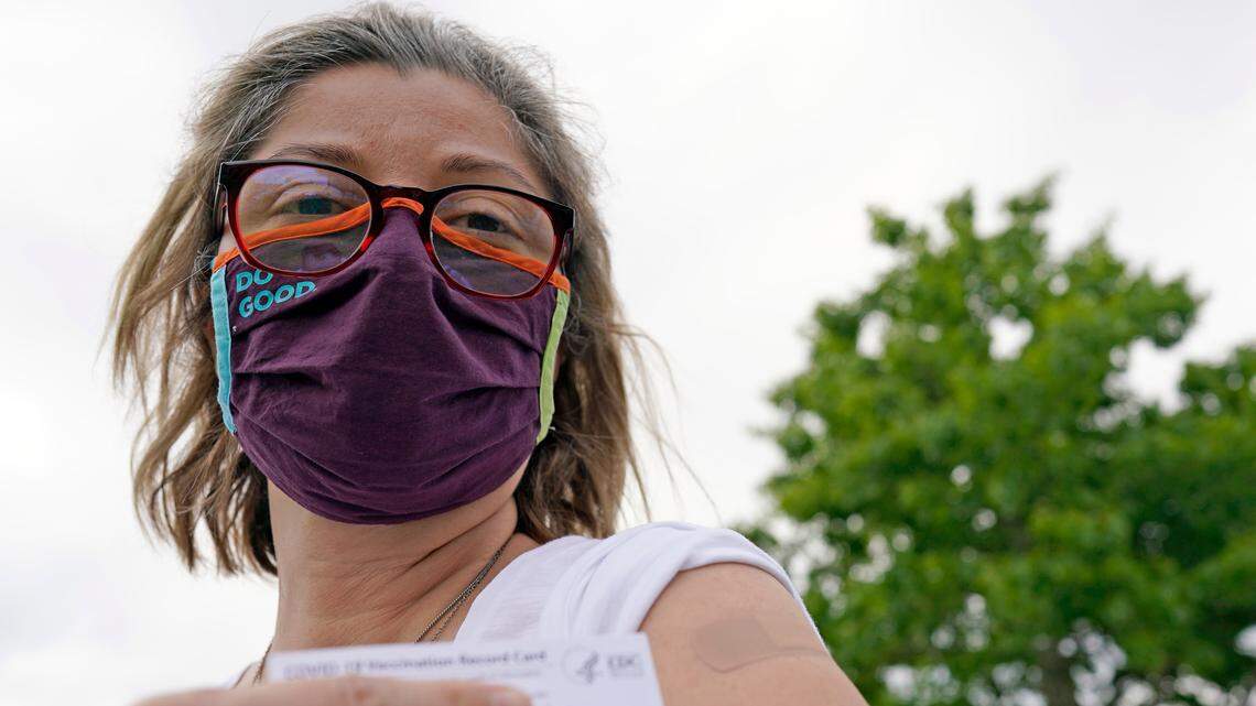 A woman poses with her vaccination card after getting her second Moderna COVID-19 shot earlier this week in in Pasadena, Texas. Tarrant County is offering no appointment vaccinations at the Hurst Conference Center until 5 p.m. Friday.