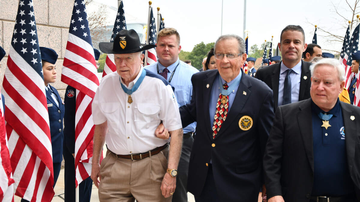 National Medal of Honor recipients (from left) Army Lt. Col. Bruce Crandall; Army Maj. General Patrick Brady; and Navy Col. Donald “Doc” Ballard enter Globe Life Park for the ceremony to announce Arlington as the new site for the National Medal of Honor Museum.