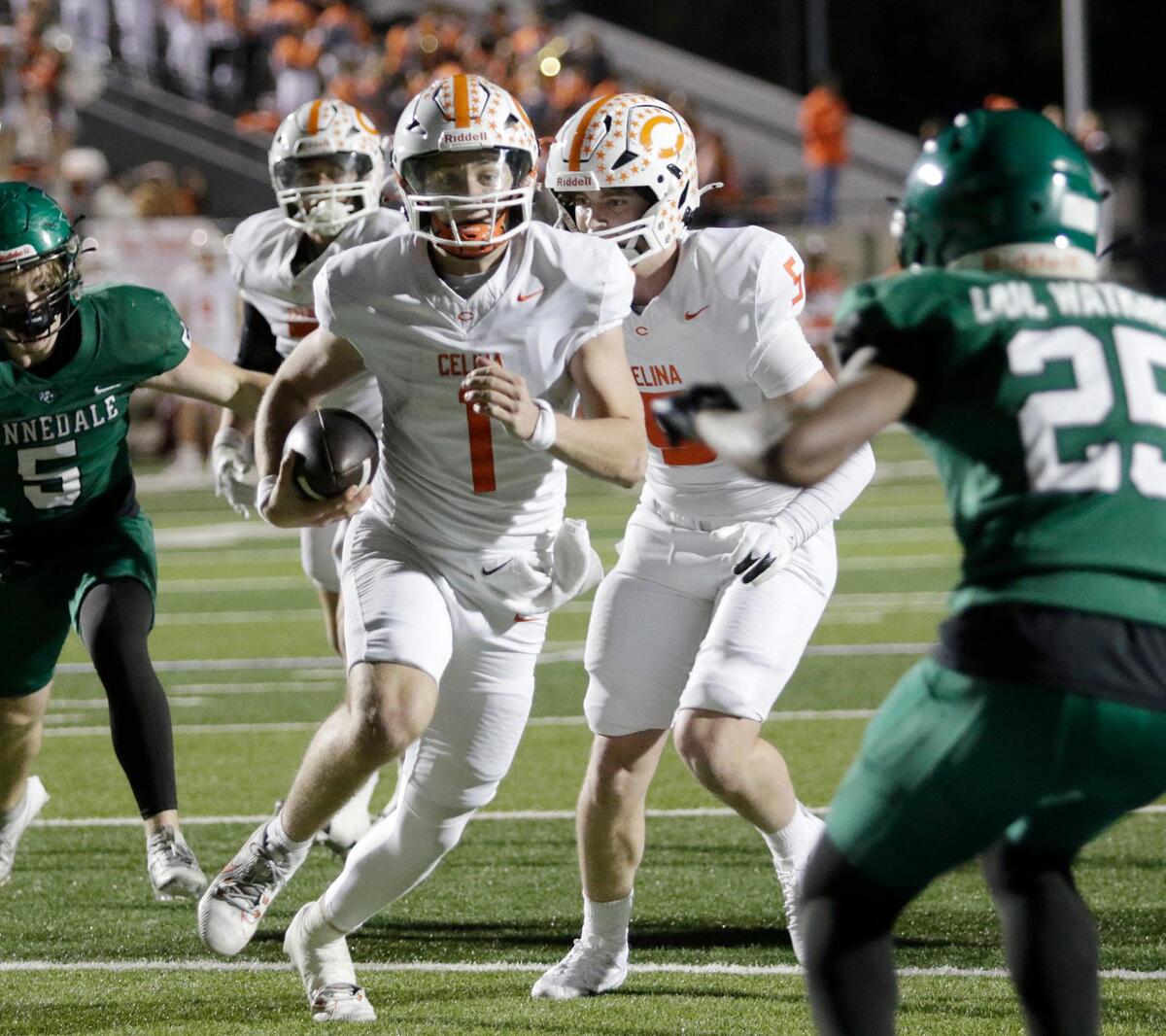 Celina’s Bowe Bentley powers into the end zone for Celina’s first score during a UIL football playoff game at Pennington Field on Friday November 22, 2024.