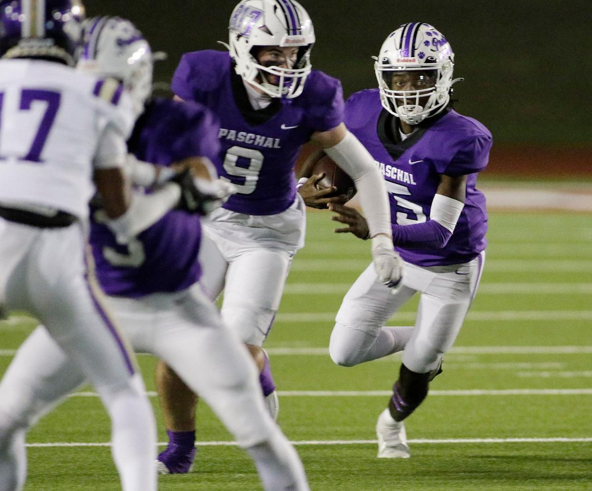 Pashal’s Jashaun Thomas follows his blockers during a UIL football game at Farrington Field Stadium on Thursday, October 4, 2024.