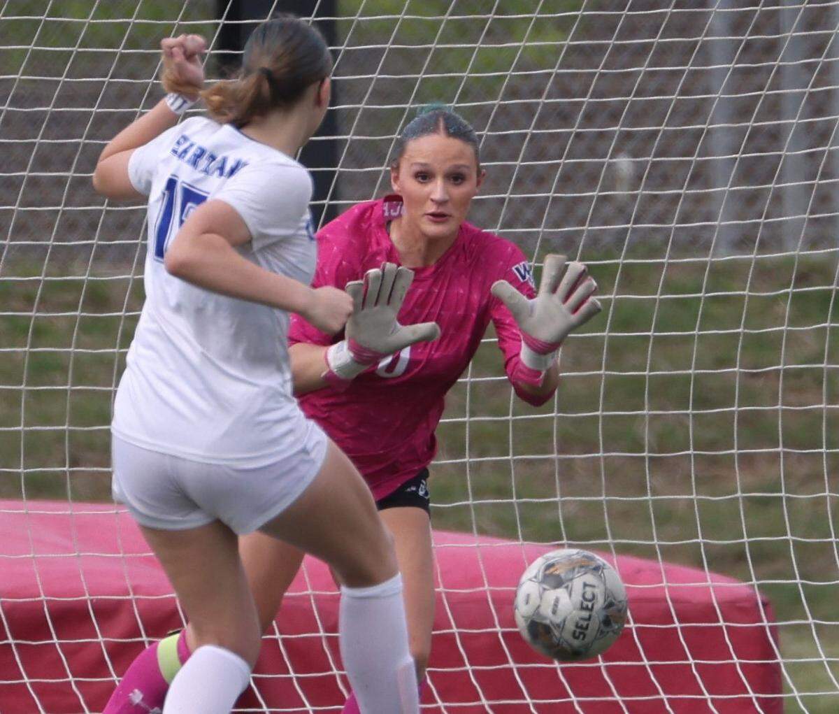 Prosper Walnut Grove keeper Finley Pike (0) makes a stop against Burleson Centennial defender Mardie Frye (15) during the second half of a UIL Conference 5A Division I state semifinal soccer game at Keller ISD Athletic Complex in Keller, Tx. Friday, April 03, 2026.