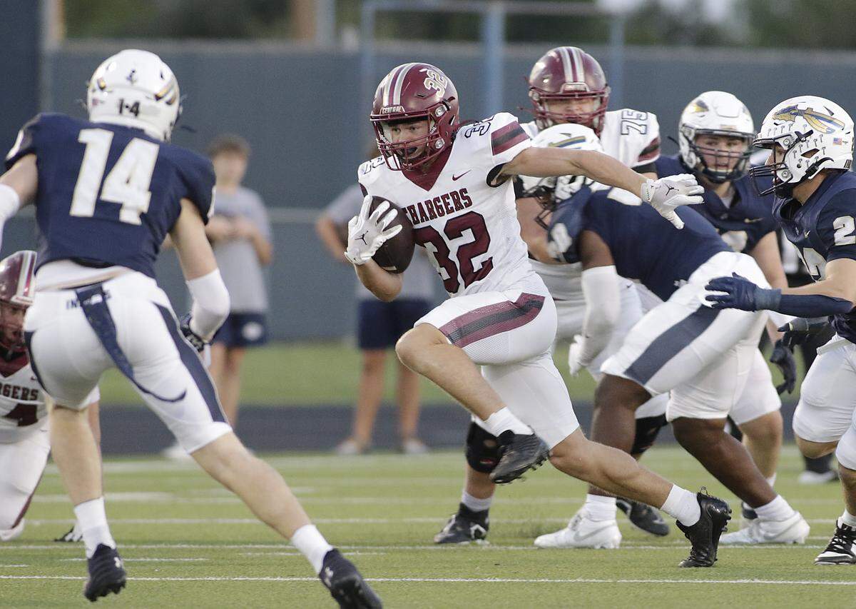 Keller Central’s Spencer Martin (32) finds a hole to run through against Keller during their game at Keller ISD Athletic Complex on Friday, Sep. 26, 2025.