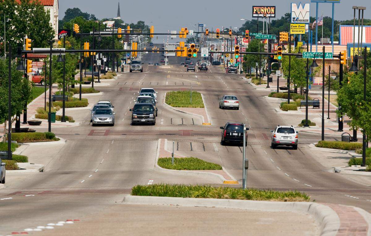 July 22, 2008: Facing east on Berry Street from the Lubbock Avenue intersection. Landscaped medians were constructed with new lighting fixtures, parallel parking spots and brick crosswalks.