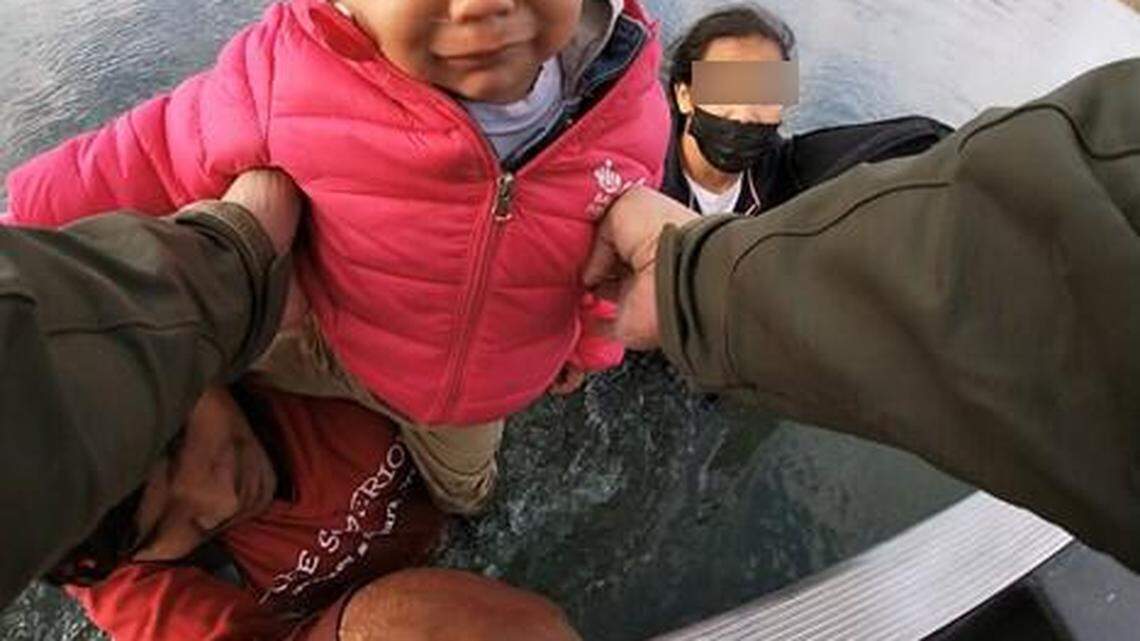 A mother, father and two young children were rescued from the river.