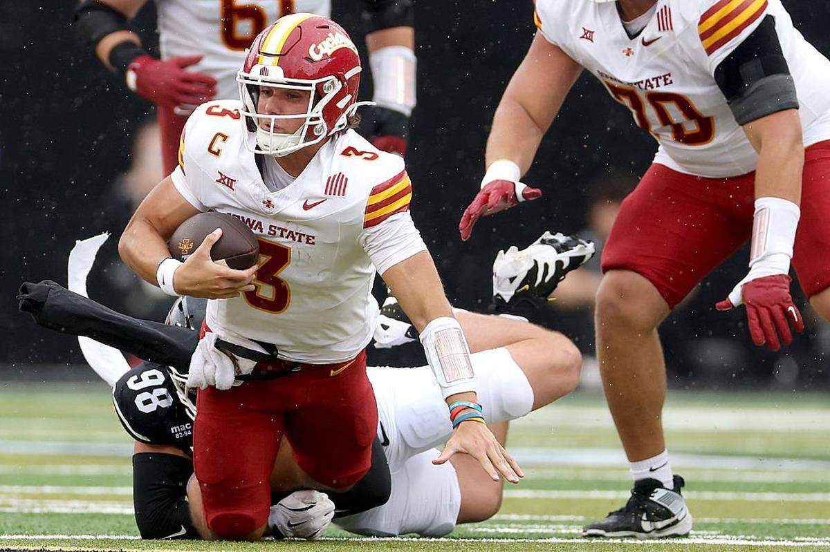 BOULDER, COLORADO - OCTOBER 11: Quarterback Rocco Becht #3 of the Iowa State Cyclones is tackled by Alexander McPherson #98 of the Colorado Buffaloes in the first quarter at Folsom Field on October 11, 2025 in Boulder, Colorado. (Photo by Matthew Stockman/Getty Images)