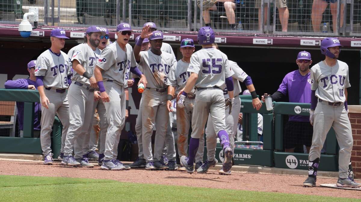 TCU third baseman Brayden Taylor (No. 55) celebrates with teammates after his home run in the sixth inning reclaimed the lead for the Horned Frogs against Oral Roberts Saturday. Kurtis Byrne followed with a homer on the next pitch. TCU won 3-1 and will play the loser between Texas A&M and Louisiana at 1 p.m. Sunday at Owen Field at Blue Bell Park in the College Station Regional.